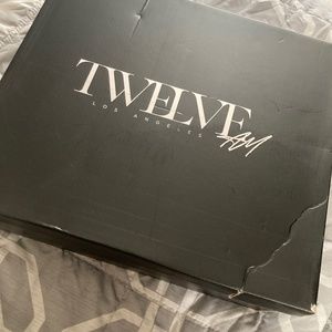 Snake print knee high boots